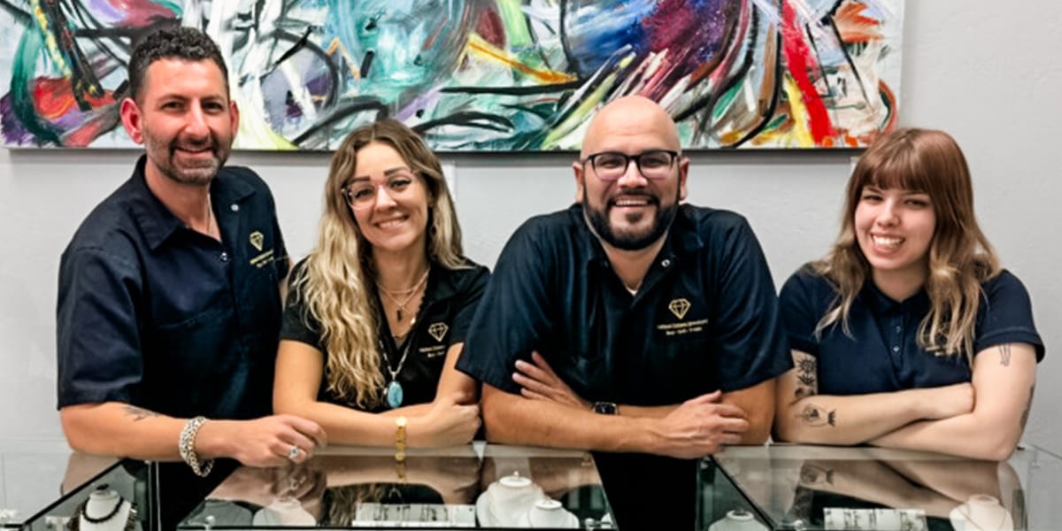 The team at Nelson Estate Jewelers posing for a photo in their Mesa AZ jewelry store.