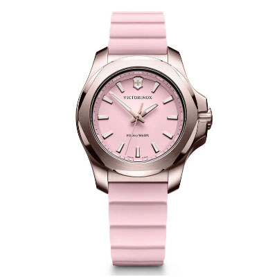 A pink Victorinox wristwatch with a pink face, metal case, and pink silicone strap, displaying the time 10:10.