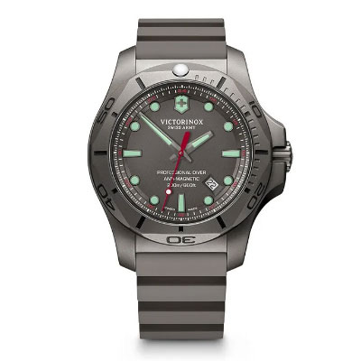 Victorinox Swiss Army professional diver watch with a grey case, black and grey striped rubber strap, and luminous markers on a dark dial.