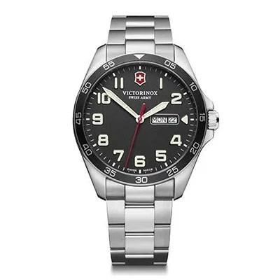 A stainless steel Victorinox Swiss Army wristwatch with a black dial, white numerals, and a date and day display at the 3 o’clock position.
