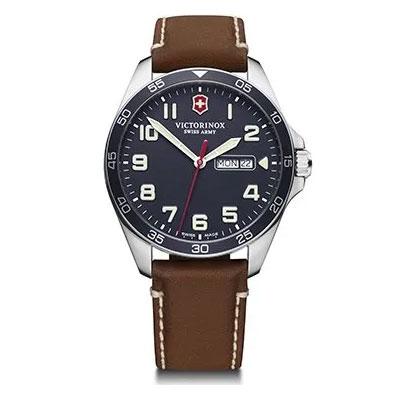 Victorinox Swiss Army wristwatch with a black dial, silver case, brown leather strap, Arabic numeral markers, and a day-date display at 3 o’clock.