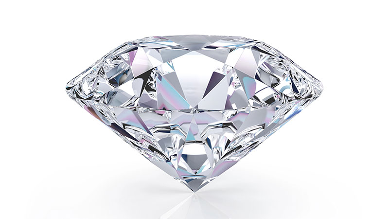 A clear, faceted diamond is displayed on a white background, showcasing its brilliant cut and reflective surfaces.